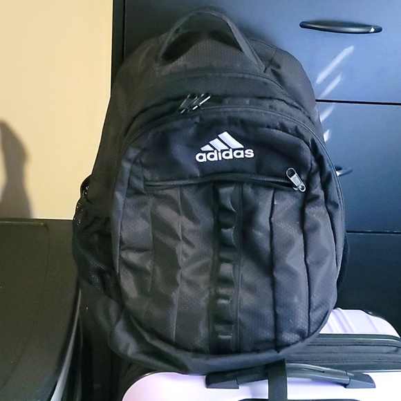 Adidas Multi zip backpack Brand new given as a gift.good for school & Et cetera